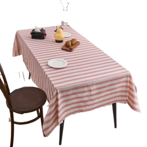Rustic red and white striped rectangular linen tablecloth on dining table setup