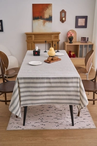 Detailed texture of Japanese style linen-cotton striped tablecloth on a dining table