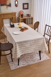 Detailed texture of Japanese beige cotton linen rectangular tablecloth with brown stripes