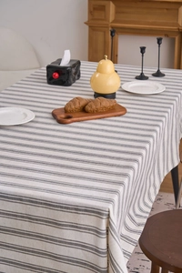 Close-up of linen-cotton tablecloth with grey stripes and durable woven texture