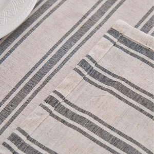 Linen cotton striped tablecloth in grey and beige with fine stitched edges and ceramic plate