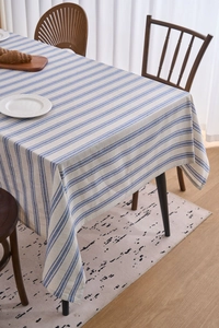 Close-up of Japanese style blue and white striped cotton linen tablecloth with lace edge