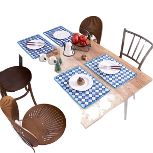 Set of 4 blue and white checkered woven placemats with elegant blue decorative piping
