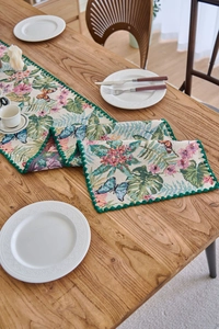 Detailed macro view of retro floral jacquard table runner with butterfly patterns