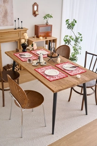 Detail of red jacquard embroidered placemat with vintage floral patterns for dining decor