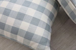 Close-up of the Nordic geometric blue and white checkered cushion cover fabric texture