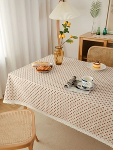 Detailed close-up of pastoral strawberry linen tablecloth with delicate white lace edge