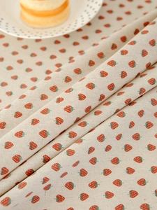 Close-up of strawberry print cotton linen fabric texture for rustic table decor