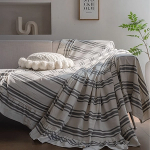 Modern minimalist cotton striped sofa cover with elegant ruffle edge and textured finish