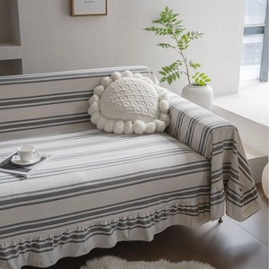 Minimalist cotton striped sofa cover with pleated edges and round knitted cushion