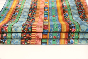 Close-up of colorful ethnic striped cotton linen fabric with bohemian geometric patterns