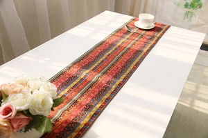Detailed view of bohemian style cotton linen table runner with ethnic geometric patterns