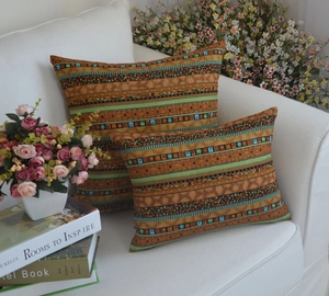 Detailed macro view of square and rectangular ethnic cushion covers with geometric patterns