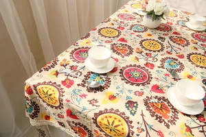 Detailed shot of bohemian mandala pattern with elegant white lace trim on linen tablecloth