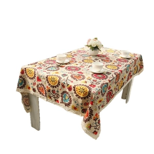 Bohemian mandala linen tablecloth with white lace edges shown from a 45-degree angle