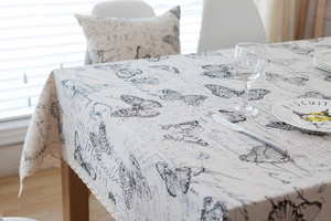 Close-up of vintage American tablecloth with butterfly print and delicate lace edges