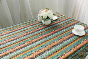 Bohemian style linen tablecloth featuring ethnic patterns and colorful geometric stripes