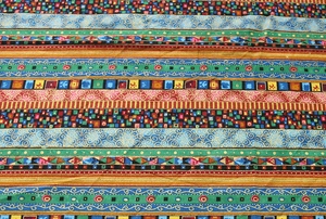 Detailed view of bohemian style table cloth with ethnic geometric patterns and stripes