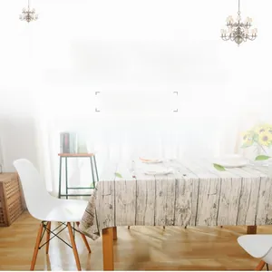 Detailed shot of vintage wood grain printed tablecloth on a dining table with chairs