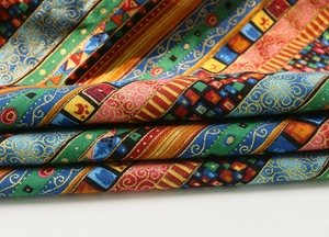 Detailed close-up showing the intricate bohemian pattern and woven texture of the cotton fabric