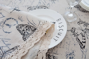 Close-up of vintage butterfly print tablecloth with exquisite crochet lace edging details