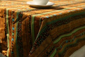 Close-up of thick cotton linen tablecloth with colorful bohemian geometric patterns