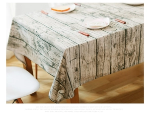 Detailed view of Nordic style wood grain pattern rectangular tablecloth on dining table