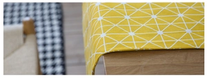 Close-up of yellow cotton linen table runner with white geometric grid patterns