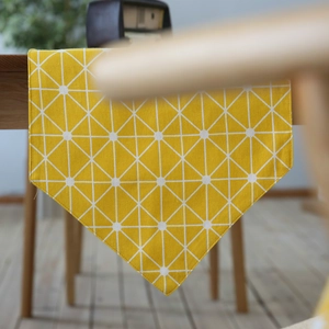Modern yellow table runner with white geometric triangle pattern for home dining decor