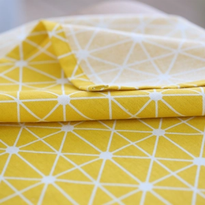 Modern yellow geometric cotton linen tablecloth with white radial lines and hemmed edges