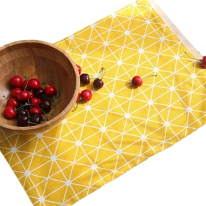 Modern lemon yellow table runner with white geometric triangle pattern for home decor