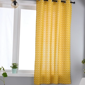 Detail of yellow cotton linen curtains with white geometric grid and black grommet top style