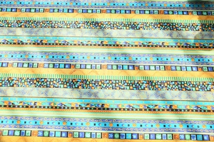 Detailed view of bohemian style cotton linen fabric with colorful geometric stripes
