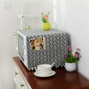 Nordic cotton linen microwave dust cover with grey herringbone pattern and side pockets