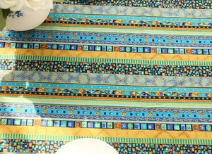 Detailed view of bohemian table runner with colorful ethnic stripes and floral pattern