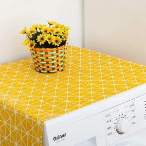 Yellow washing machine dust cover featuring white geometric patterns and smooth stitching