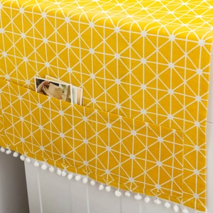 Yellow geometric washing machine cover with side pockets and white pom-pom fringe edge