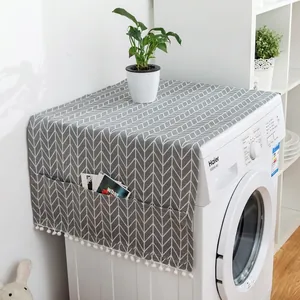 Gray geometric washing machine cover with side storage pockets and white tassel trim