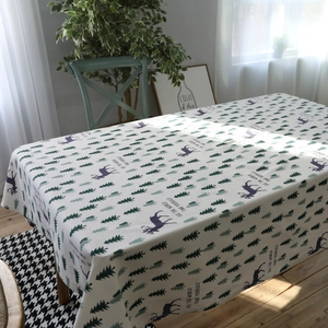Modern cotton linen tablecloth featuring green pine trees and deer silhouette pattern