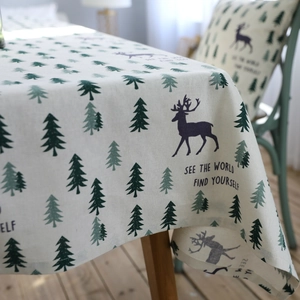 Modern linen tablecloth with green pine trees and elk print in Nordic minimalist style