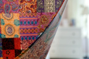 Close-up of bohemian linen curtain showing double-sided ethnic patterns and thick texture