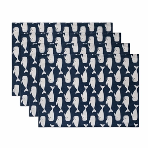 Set of four navy blue cotton placemats featuring white whale patterns in a tiered layout