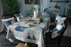 Modern geometric waterproof tablecloth with matching cushions for a minimalist dining setup
