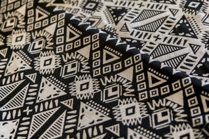 Detail of black and white geometric jacquard fabric with bohemian ethnic patterns