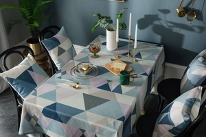 Close-up of waterproof Nordic tablecloth featuring modern geometric triangle patterns