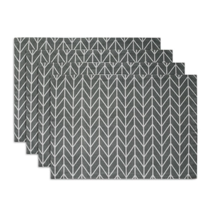 Close-up of bohemian grey and white herringbone placemats with neat stitched edges