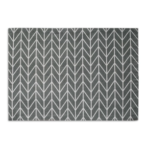 Detail of gray and white herringbone pattern on a rectangular double-layer placemat