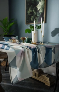 Close-up of geometric triangle pattern and hemmed edge of waterproof Nordic tablecloth