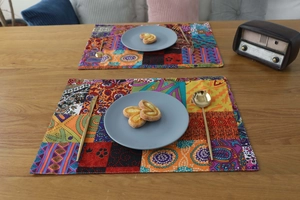 Macro detail of Bohemian patchwork cotton linen placemat on a wooden dining table