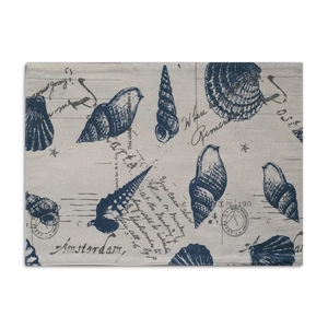 Close-up detail of rectangular cotton linen placemat with blue seashell and ocean prints